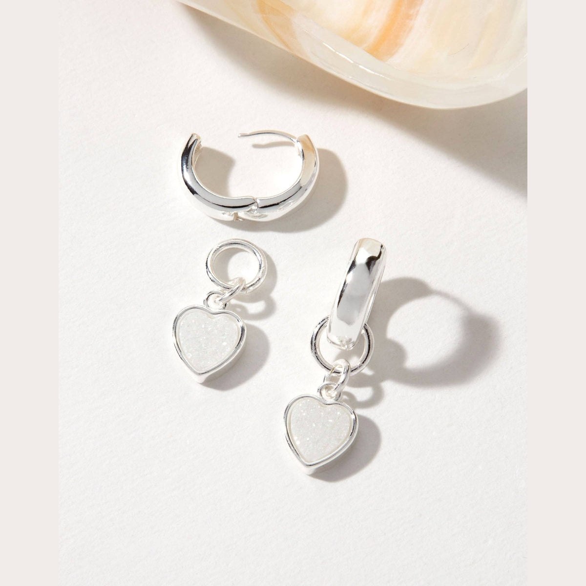 Heart's Accelerated Huggie Hoop Earring Silver